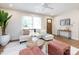 Open living room featuring a comfortable sofa, round wood coffee table, and stylish decor at 1152 Penrose Ln, Charlotte, NC 28217