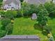 Aerial view of a large, green backyard with a shed and mature trees at 121 Royalton Rd, Mooresville, NC 28115