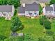 Aerial view of a spacious, well-maintained backyard with lush green grass and a patio area, perfect for outdoor entertaining at 121 Royalton Rd, Mooresville, NC 28115