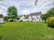 Expansive backyard with mature trees and green lawn at 121 Royalton Rd, Mooresville, NC 28115