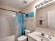 Well-lit bathroom featuring a shower-tub combo, single sink vanity, and decorative mermaid themed accents at 121 Royalton Rd, Mooresville, NC 28115