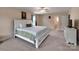 Well-lit carpeted bedroom with an en-suite bathroom and ceiling fan at 121 Royalton Rd, Mooresville, NC 28115
