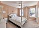 Comfortable bedroom featuring a four poster bed, neutral tones and bright natural light at 121 Royalton Rd, Mooresville, NC 28115