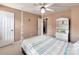A well lit bedroom with a four poster bed, neutral walls and carpet at 121 Royalton Rd, Mooresville, NC 28115