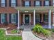 Charming front porch with seating area and decorative plants, perfect for relaxing at 121 Royalton Rd, Mooresville, NC 28115