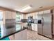 Modern kitchen with stainless steel appliances, granite countertops, and tile backsplash at 121 Royalton Rd, Mooresville, NC 28115