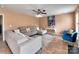 Comfortable living room with an area rug, ceiling fan, and a gray sectional sofa at 121 Royalton Rd, Mooresville, NC 28115