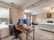 Home office space with modern desk and dual monitors connected to the bedroom at 121 Royalton Rd, Mooresville, NC 28115