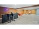 Spacious finished basement with a bar area, entertainment space, and vinyl plank flooring at 12923 Plumleaf Dr, Charlotte, NC 28213