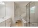 Bright bathroom with a shower and a separate soaking tub at 12923 Plumleaf Dr, Charlotte, NC 28213