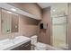 Modern bathroom featuring a vanity with a sleek sink and a glass-enclosed shower at 12923 Plumleaf Dr, Charlotte, NC 28213