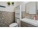 Stylish bathroom featuring a mosaic accent wall, modern vanity, and coordinated decor at 12923 Plumleaf Dr, Charlotte, NC 28213