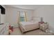 Cozy bedroom with a window that brings in lots of natural light at 12923 Plumleaf Dr, Charlotte, NC 28213
