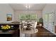 Inviting dining area with hardwood floors, natural light, and a cozy breakfast nook at 12923 Plumleaf Dr, Charlotte, NC 28213