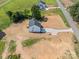 Aerial view of the home, driveway and ample land, perfect for privacy or expansion, nearby a country road at 1308 Austin Chaney Rd, Wingate, NC 28174