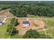 Aerial view of a new home on a spacious lot, showcasing its modern design and landscaping potential at 1308 Austin Chaney Rd, Wingate, NC 28174