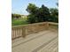 A newly constructed wooden back deck overlooks a lush, green backyard at 1308 Austin Chaney Rd, Wingate, NC 28174