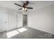 Neutral bedroom with carpeted floors, a ceiling fan, and plenty of natural light at 1308 Austin Chaney Rd, Wingate, NC 28174