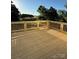 New wooden deck with railings overlooking a serene outdoor setting at 1308 Austin Chaney Rd, Wingate, NC 28174