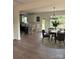 Open-concept dining area with a modern chandelier, round table, and easy access to the kitchen at 1308 Austin Chaney Rd, Wingate, NC 28174
