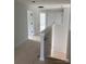 Hallway construction featuring fresh white paint, trim, and stairwell at 1308 Austin Chaney Rd, Wingate, NC 28174