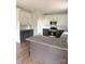 A modern kitchen featuring a granite countertop island, stainless steel appliances, and gray base cabinets at 1308 Austin Chaney Rd, Wingate, NC 28174