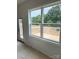 Large window overlooking the deck and outdoor view at 1308 Austin Chaney Rd, Wingate, NC 28174