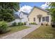 This house has a patio with a walkway to the rest of the backyard at 14105 Garden District Row, Huntersville, NC 28078