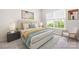 This bedroom features a queen bed with a light gray headboard, blue and gold accents, and a gray nightstand at 14105 Garden District Row, Huntersville, NC 28078
