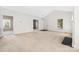 Bright and airy living room offering generous space and neutral carpet, perfect for customization at 14105 Garden District Row, Huntersville, NC 28078