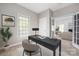 Bright home office with large window, sleek desk, decor, and an open doorway to the living room at 14105 Garden District Row, Huntersville, NC 28078