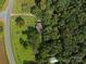 Overhead view of a home nestled among mature trees and greenery at 14415 Old Beatty Ford Rd, Gold Hill, NC 28071