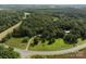 Aerial view of a property with lush greenery and surrounding trees at 14415 Old Beatty Ford Rd, Gold Hill, NC 28071
