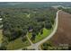 Scenic aerial view of a tree-lined property near a highway at 14415 Old Beatty Ford Rd, Gold Hill, NC 28071