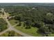 A beautiful aerial view of a lush, tree-filled property adjacent to a road at 14415 Old Beatty Ford Rd, Gold Hill, NC 28071