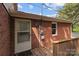 Back door leading to wood deck of attractive brick home, perfect for outdoor living at 14415 Old Beatty Ford Rd, Gold Hill, NC 28071
