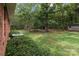 Lush backyard with sheds and picnic table at 14415 Old Beatty Ford Rd, Gold Hill, NC 28071