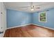 Bedroom with hardwood flooring, ceiling fan, and window at 14415 Old Beatty Ford Rd, Gold Hill, NC 28071
