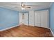 Bedroom with hardwood flooring, ceiling fan, and a closet at 14415 Old Beatty Ford Rd, Gold Hill, NC 28071