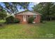 Charming brick home with a well-manicured lawn and beautiful landscaping at 14415 Old Beatty Ford Rd, Gold Hill, NC 28071