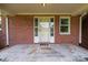 Welcoming front porch featuring a brick exterior and a covered entryway at 14415 Old Beatty Ford Rd, Gold Hill, NC 28071