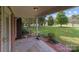 Covered front porch with brick accents, perfect for relaxing and enjoying the outdoors at 14415 Old Beatty Ford Rd, Gold Hill, NC 28071