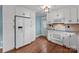 Charming kitchen with white cabinets, granite countertops, and stainless steel appliances at 14415 Old Beatty Ford Rd, Gold Hill, NC 28071