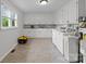 Laundry room with washer, dryer, and storage cabinets at 14415 Old Beatty Ford Rd, Gold Hill, NC 28071