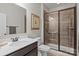 Modern bathroom featuring a glass-enclosed shower and contemporary vanity at 16034 Rushwick Dr, Huntersville, NC 28078
