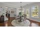 Inviting dining area with neutral tones, offering seamless transition to the living room and natural light at 16034 Rushwick Dr, Huntersville, NC 28078