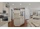 Spacious kitchen featuring an island, stainless steel appliances, and granite counters at 16034 Rushwick Dr, Huntersville, NC 28078