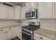 Kitchen features stainless steel microwave and range at 16034 Rushwick Dr, Huntersville, NC 28078