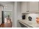 Kitchen nook with granite counters and hardwood floors looking into breakfast area at 16034 Rushwick Dr, Huntersville, NC 28078