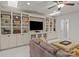 Bright living room boasts custom built-ins, ideal for displaying decor and storage at 16034 Rushwick Dr, Huntersville, NC 28078